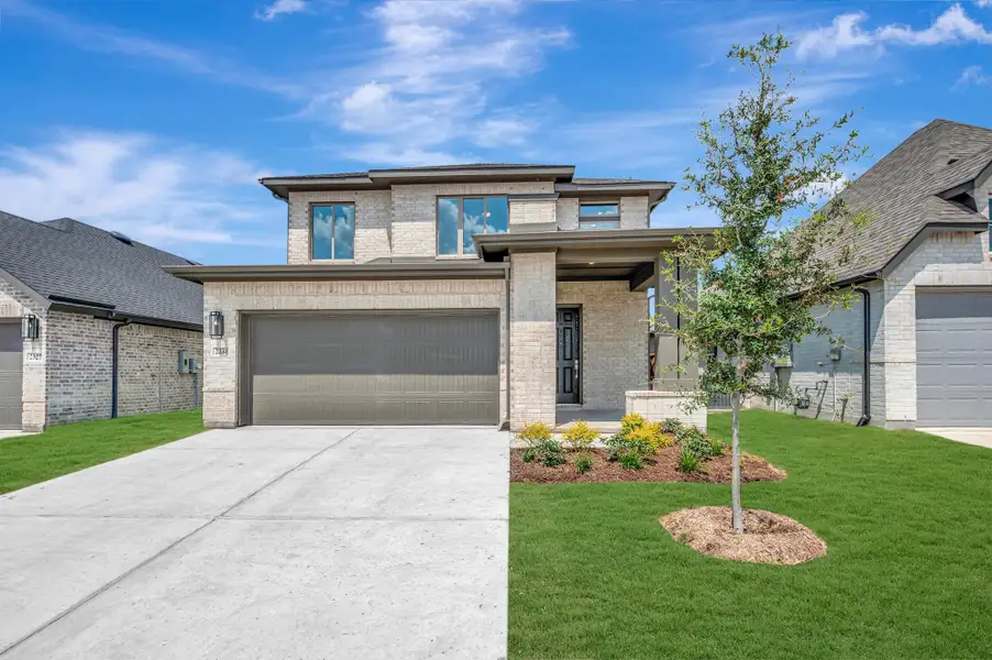 Front exterior of a new home in Creekshaw – Gardens, Royse City, TX, highlighting curb appeal (Image 1). Front exterior of a new home in Creekshaw – Gardens, Royse City, TX, highlighting curb appeal (Image 1).