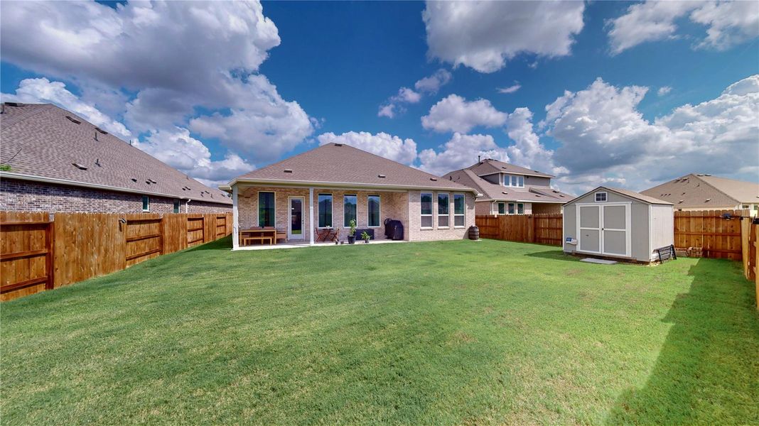 Exterior details and patio area of a home in ARTAVIA, Conroe (Image 21). Exterior details and patio area of a home in ARTAVIA, Conroe (Image 21).