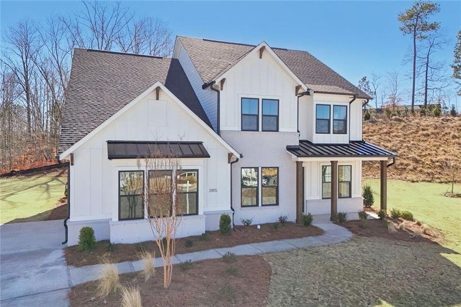 Front exterior of a new home in Sterling Pointe, Cumming, GA, highlighting curb appeal (Image 29).