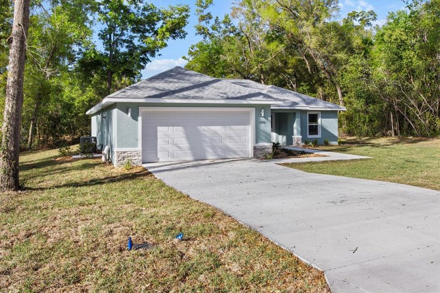 Front exterior of a new home in , Citrus Springs, FL, highlighting curb appeal (Image 2). Front exterior of a new home in , Citrus Springs, FL, highlighting curb appeal (Image 2).