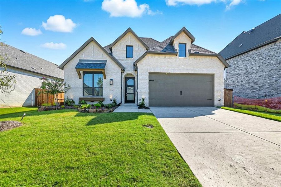 Front exterior of a new home in Trinity Falls, McKinney, TX, highlighting curb appeal (Image 19).
