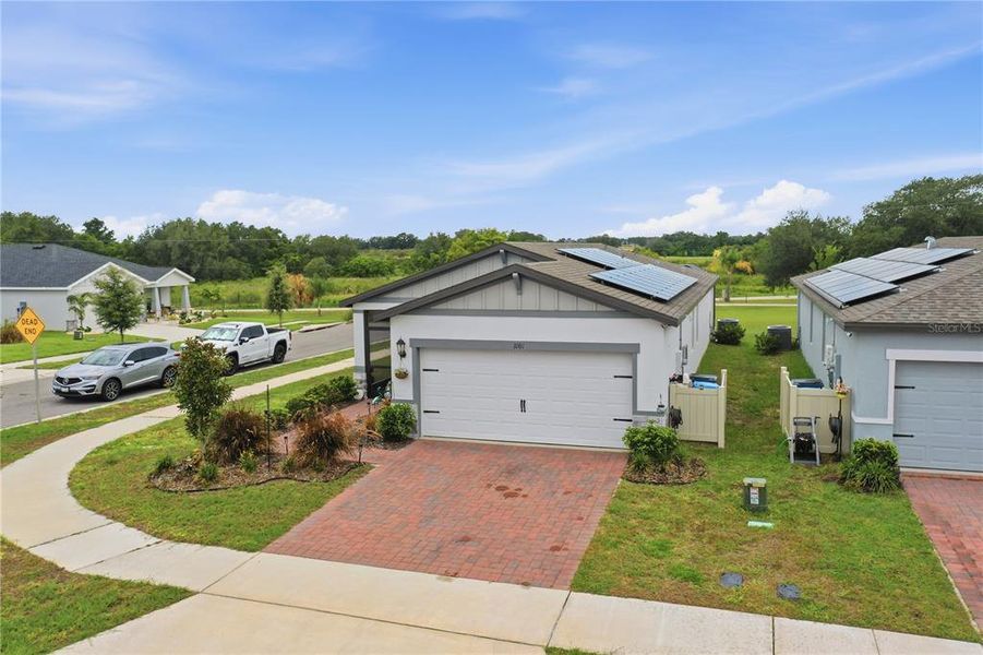 Front exterior of a new home in , Haines City, FL, highlighting curb appeal (Image 22).