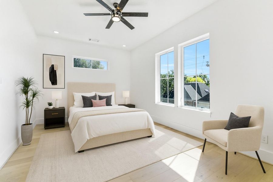 Beautifully proportioned and filled with natural light, this third-floor bedroom exudes modern comfort and understated elegance. Featuring soaring ceilings, oversized picture windows, and wide-plank European white oak floors, the room feels open and inviting. Thoughtful staging illustrates its versatility — ideal as a guest suite, private office, or secondary primary — complete with direct access to a full ensuite bath. Virtually staged Beautifully proportioned and filled with natural light, this third-floor bedroom exudes modern comfort and understated elegance. Featuring soaring ceilings, oversized picture windows, and wide-plank European white oak floors, the room feels open and inviting. Thoughtful staging illustrates its versatility — ideal as a guest suite, private office, or secondary primary — complete with direct access to a full ensuite bath. Virtually staged
