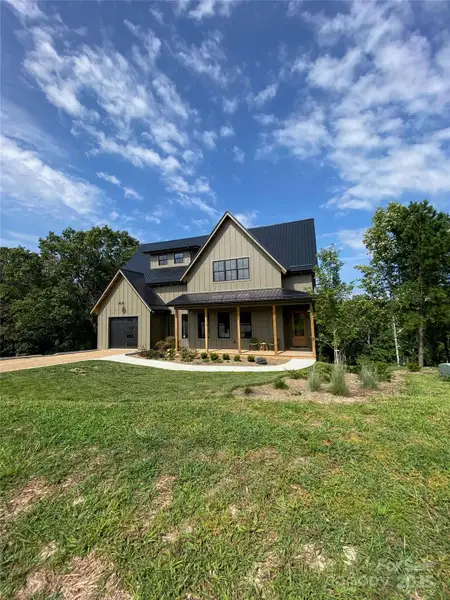 Front exterior of a new home in , Asheville, NC, highlighting curb appeal (Image 2). Front exterior of a new home in , Asheville, NC, highlighting curb appeal (Image 2).