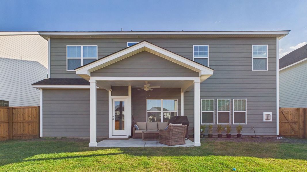 Exterior details and patio area of a home in Hewing Farms, Summerville (Image 29).