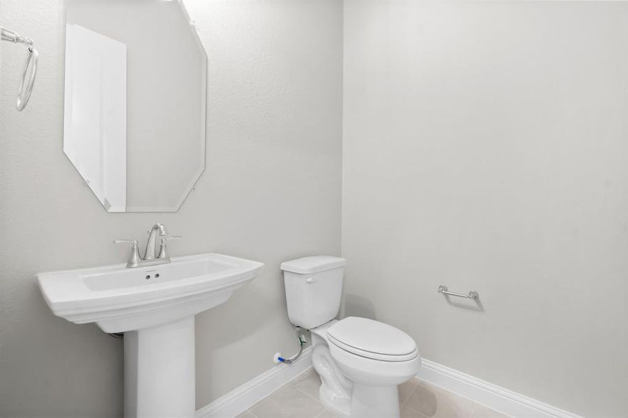 Half bath with a pedestal sink.