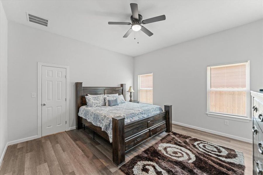 Bedroom featuring light wood-type flooring and a ceiling fan