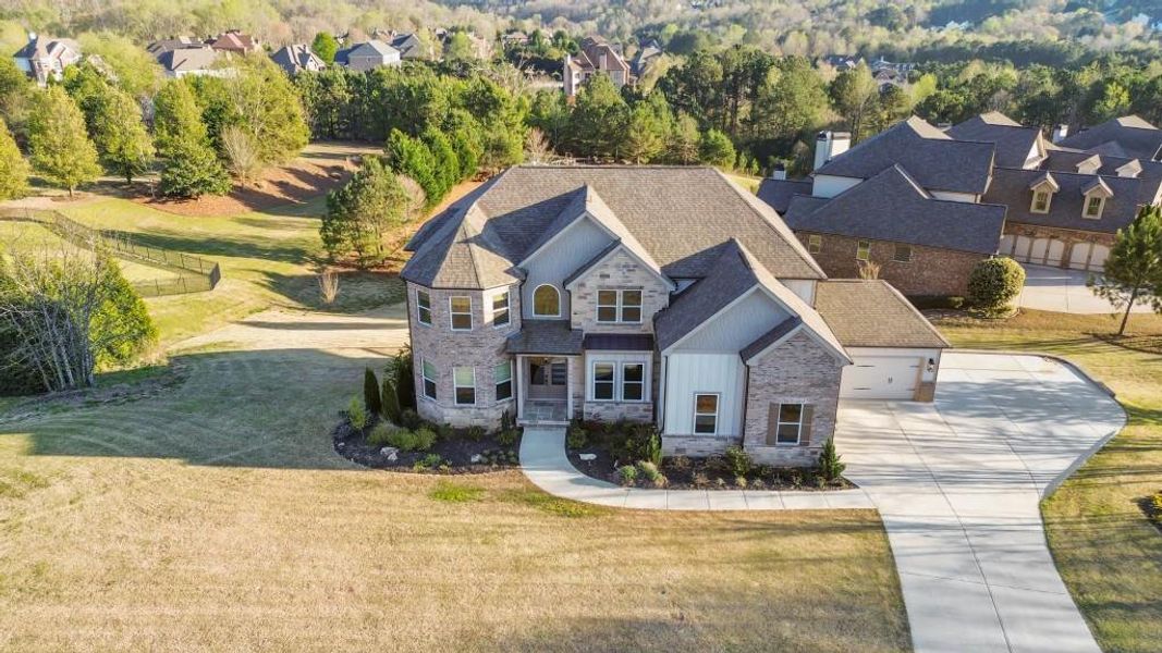 Front exterior of a new home in , Flowery Branch, GA, highlighting curb appeal (Image 26).