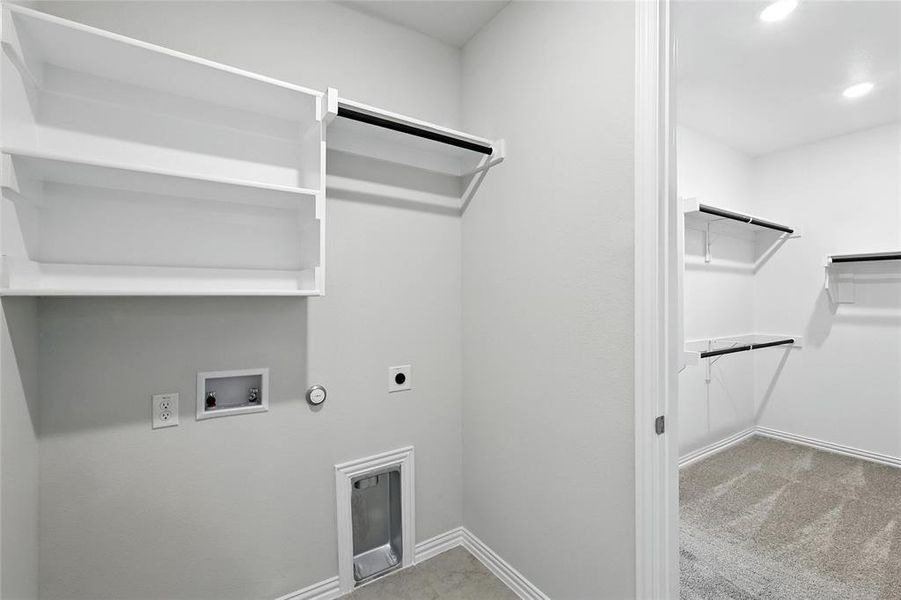 Laundry room with hookup for a gas dryer, hookup for a washing machine, electric dryer hookup, recessed lighting, and carpet Laundry room with hookup for a gas dryer, hookup for a washing machine, electric dryer hookup, recessed lighting, and carpet