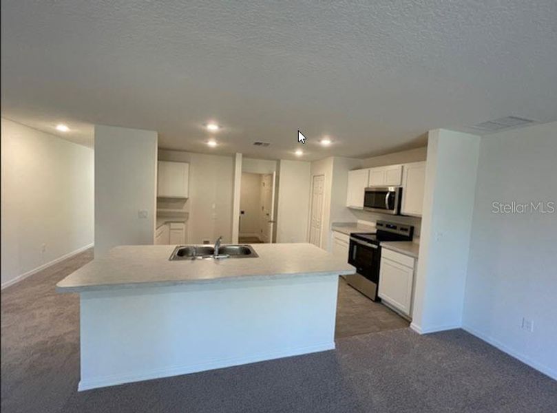 Furnished interior view inside a new home in Palm Coast: Value Collection, Palm Coast (Image 4). Furnished interior view inside a new home in Palm Coast: Value Collection, Palm Coast (Image 4).