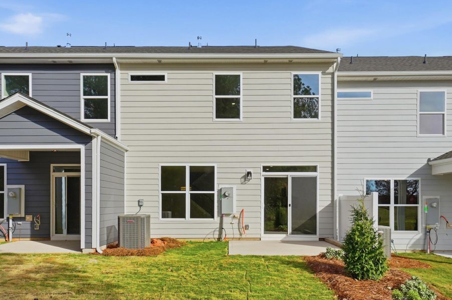 Exterior details and patio area of a home in Blythe Mill Townhomes, Waxhaw (Image 4). Exterior details and patio area of a home in Blythe Mill Townhomes, Waxhaw (Image 4).