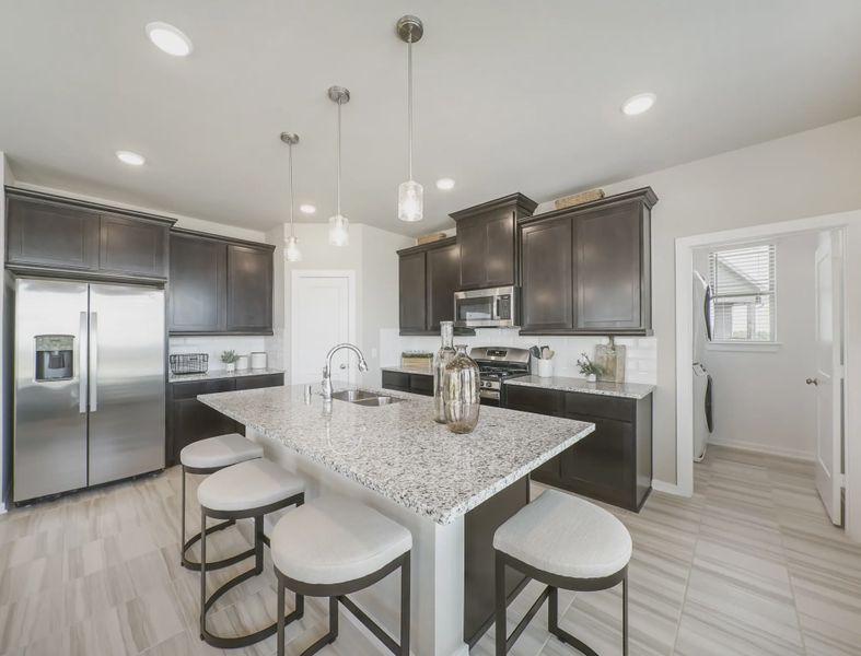 Representative furnished interior of a home built from the Springfield by Chesmar Homes in Sienna Courtyard, Missouri City (Image 7).
