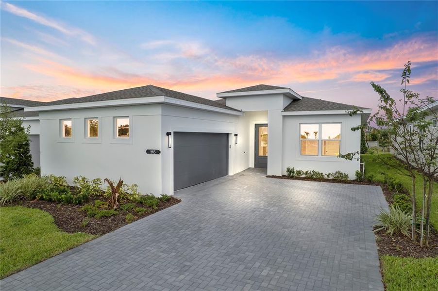 Front exterior of a new home in Cresswind at Hammock Oaks, Lady Lake, FL, highlighting curb appeal (Image 1). Front exterior of a new home in Cresswind at Hammock Oaks, Lady Lake, FL, highlighting curb appeal (Image 1).