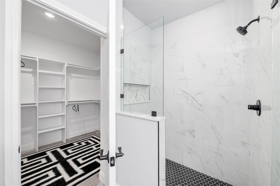 Bathroom featuring tiled shower