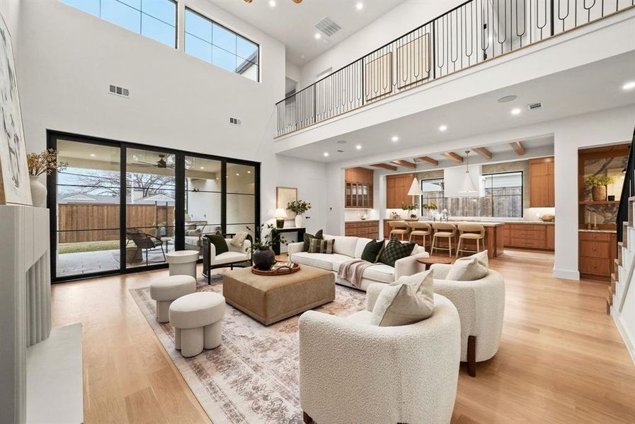 Living room featuring recessed lighting and light wood-style floors Living room featuring recessed lighting and light wood-style floors