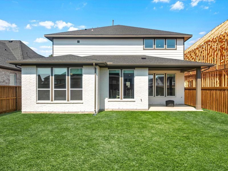 Front exterior of a new home in Woodson’s Reserve 50′, Spring, TX, highlighting curb appeal (Image 19). Front exterior of a new home in Woodson’s Reserve 50′, Spring, TX, highlighting curb appeal (Image 19).