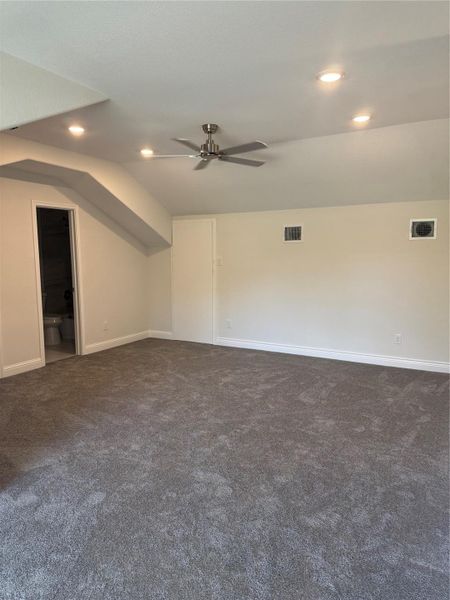 Large game room upstairs with a full bath and walk in closet