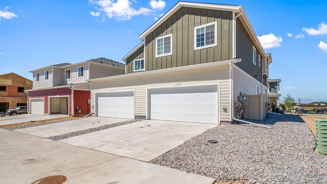 Front exterior of a new home in Green Valley Ranch, Aurora, CO, highlighting curb appeal (Image 21). Front exterior of a new home in Green Valley Ranch, Aurora, CO, highlighting curb appeal (Image 21).