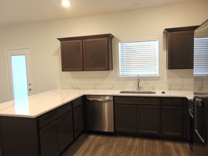 This is a sleek and modern kitchen to cook your family meals has stainless steel appliances and staggered cabinetry, as well as dreamy crowns This is a sleek and modern kitchen to cook your family meals has stainless steel appliances and staggered cabinetry, as well as dreamy crowns