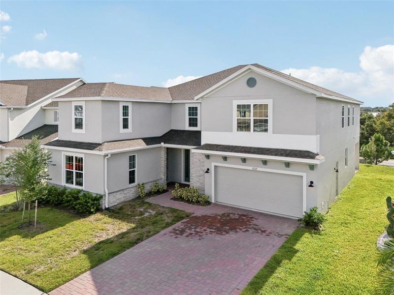 Front exterior of a new home in , Groveland, FL, highlighting curb appeal (Image 24). Front exterior of a new home in , Groveland, FL, highlighting curb appeal (Image 24).