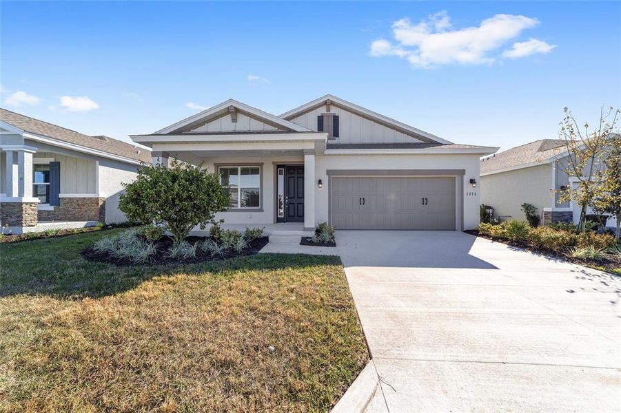 Front exterior of a new home in Calesa Township, Ocala, FL, highlighting curb appeal (Image 19).