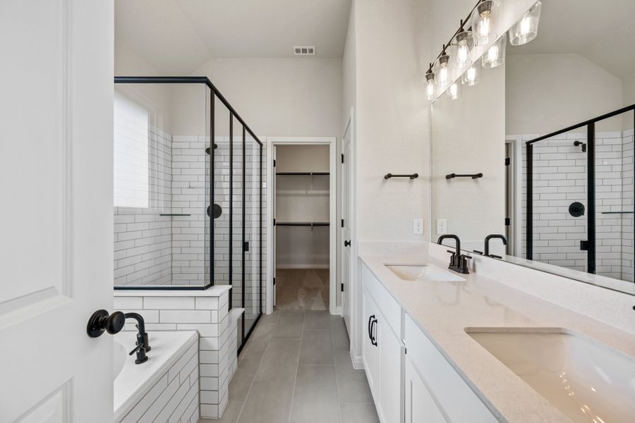 Representative furnished interior of a home built from the Manchester II by Ashton Woods in Lagos Reserve, Manor (Image 15).