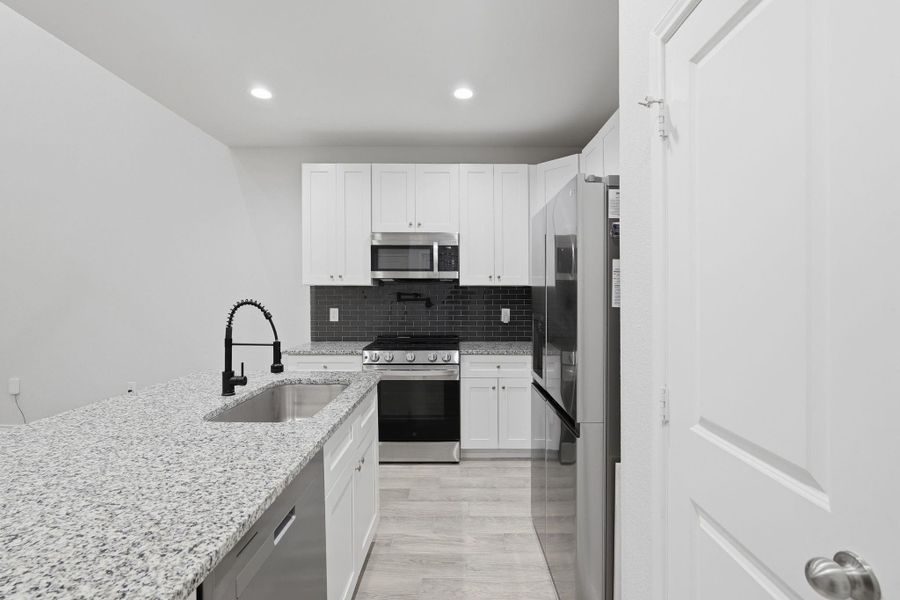 Furnished interior view inside a new home in Arrowhead Lakes, Willis (Image 7).