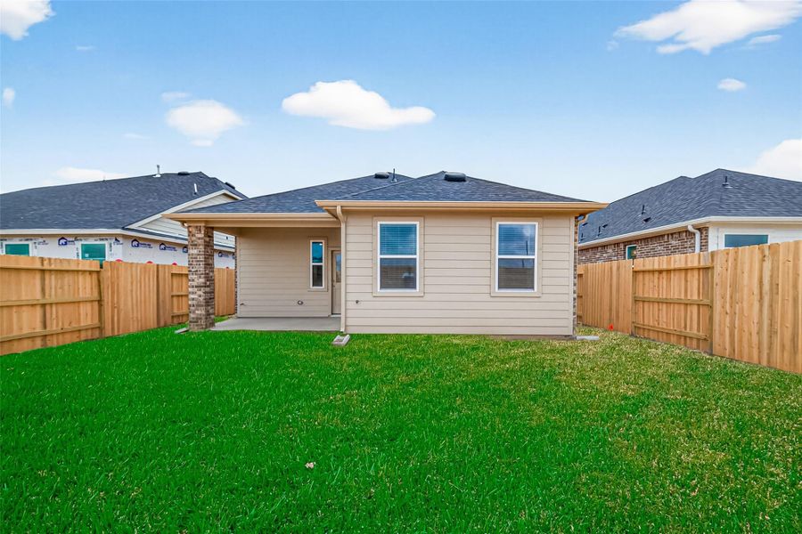 Exterior details and patio area of a home in Rates starting as low as, Iowa Colony (Image 3).