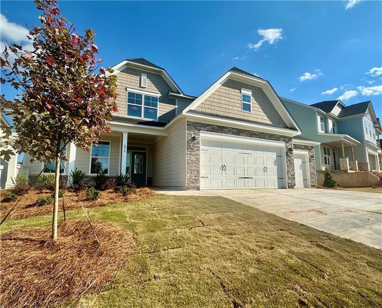 Front exterior of a new home in Twin Lakes, Hoschton, GA, highlighting curb appeal (Image 2).