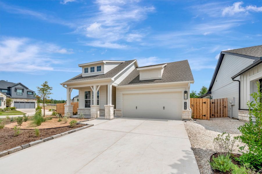 Front exterior of a new home in COLTON - Reserve Collection, Todd Mission, TX, highlighting curb appeal (Image 2). Front exterior of a new home in COLTON - Reserve Collection, Todd Mission, TX, highlighting curb appeal (Image 2).