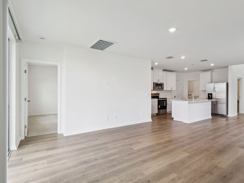 Spacious, unfurnished interior of a new home in The Reserve at Hammock Oaks - Classic Series, Lady Lake (Image 8).