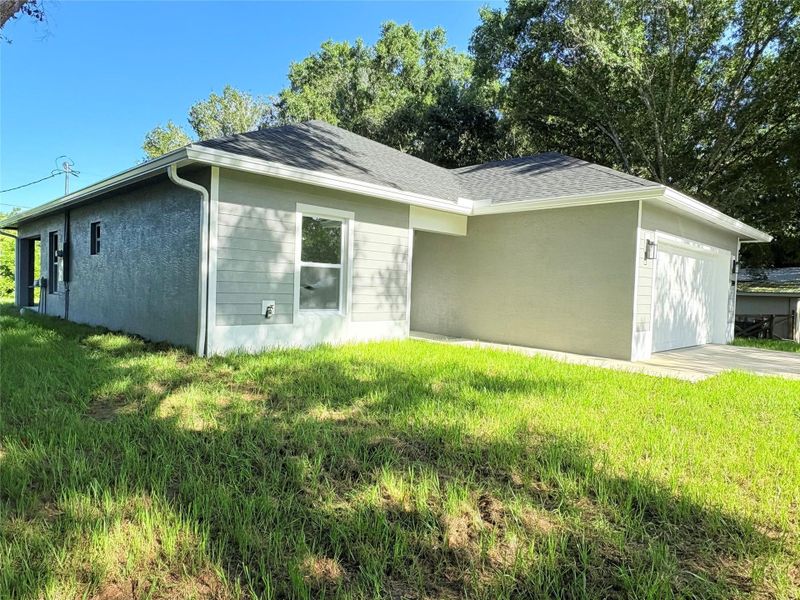 Front exterior of a new home in , Okeechobee, FL, highlighting curb appeal (Image 20).