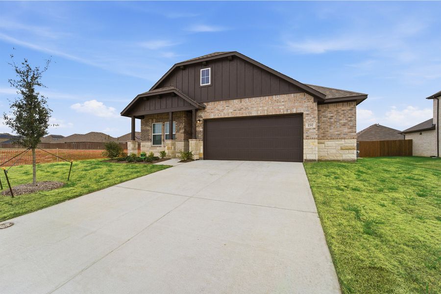 Front exterior of a new home in Saddlebrook Estates, Waxahachie, TX, highlighting curb appeal (Image 2).