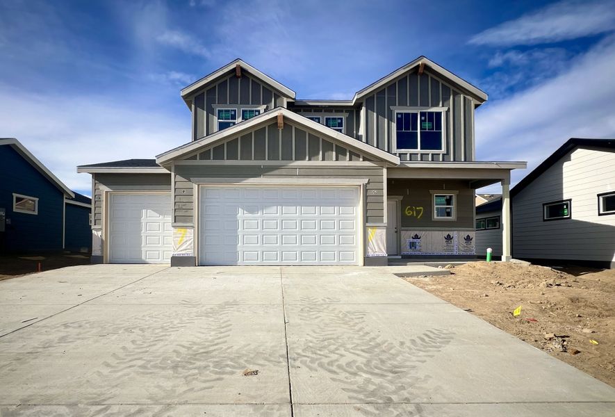 Front exterior of a new home in Union Colony West, Greeley, CO, highlighting curb appeal (Image 17).