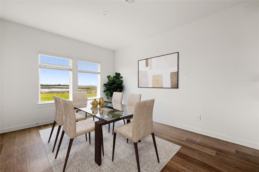 Enjoy meals in this bright and elegant dining area, perfectly positioned by large windows offering serene views. The perfect backdrop for both everyday living and special occasions. *Virtually Staged