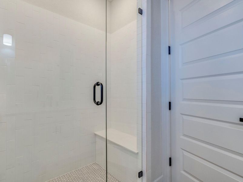 Primary bath walk-in shower with built in bench