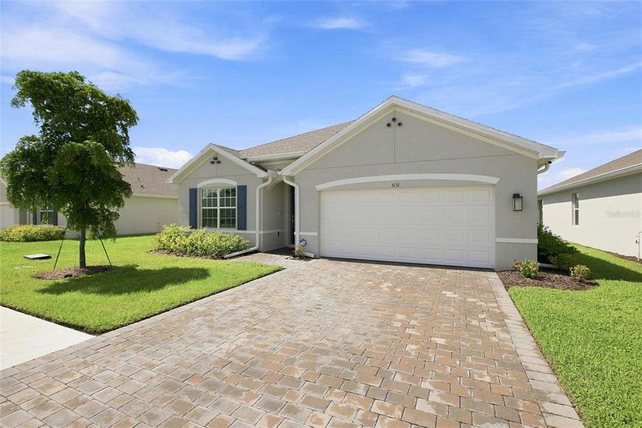 Front exterior of a new home in Central Parc, North Port, FL, highlighting curb appeal (Image 22). Front exterior of a new home in Central Parc, North Port, FL, highlighting curb appeal (Image 22).