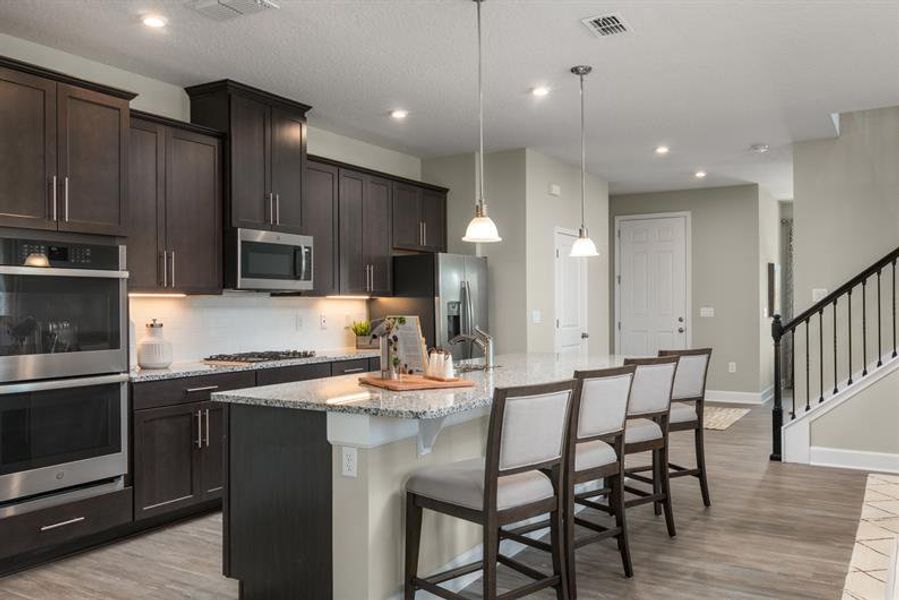 Representative furnished interior of a home built from the Hutchinson by Ryan Homes in Lake Mattie Preserve Single-Family, Auburndale (Image 3). Representative furnished interior of a home built from the Hutchinson by Ryan Homes in Lake Mattie Preserve Single-Family, Auburndale (Image 3).