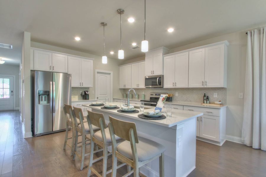 Prep dinner at the kitchen island while entertaining guests in the great room.