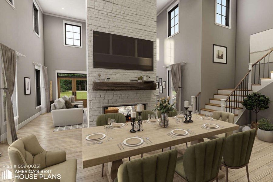 Dining space featuring a high ceiling, light wood-style flooring, plenty of natural light, and a multi sided fireplace