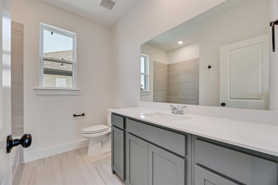 Full bath with vanity, recessed lighting, and a shower Full bath with vanity, recessed lighting, and a shower