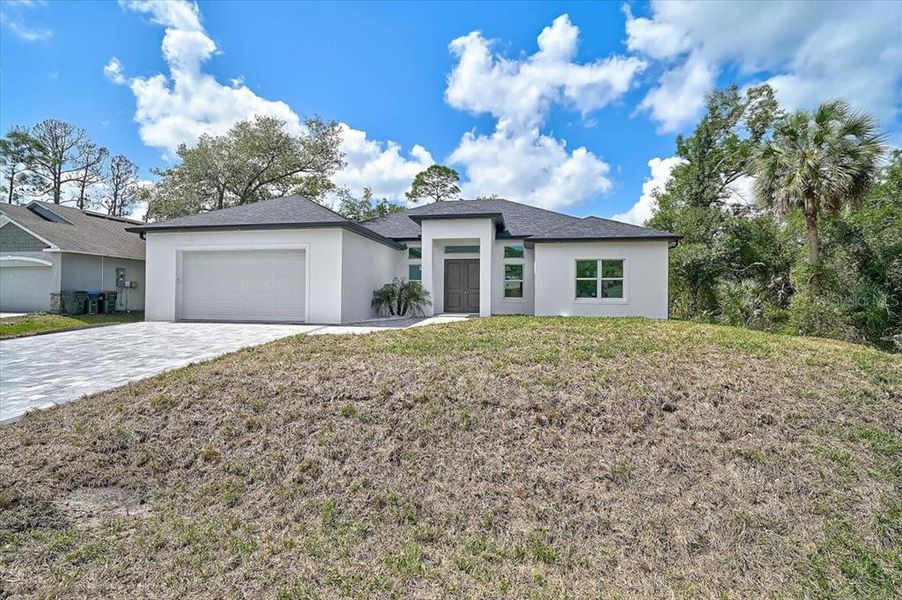 Front exterior of a new home in , North Port, FL, highlighting curb appeal (Image 24).