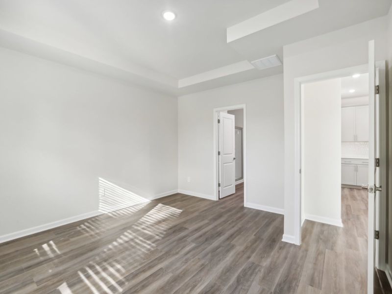 Primary bedroom in the Chandler floorplan at a Meritage Homes community in Angier, NC.