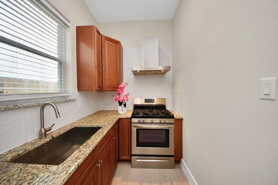 Has a large sink and a window Has a large sink and a window