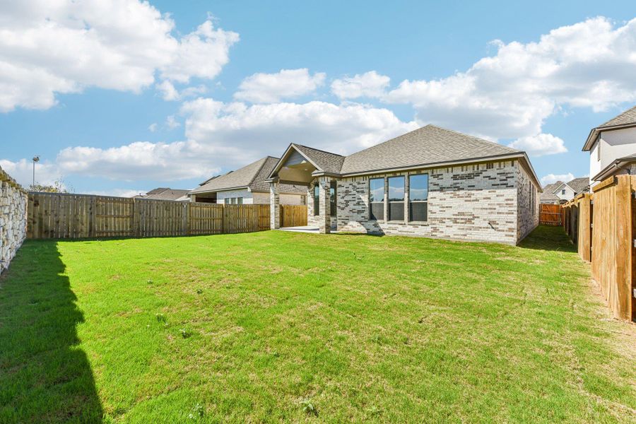 Exterior details and patio area of a home in 6 Creeks, Kyle (Image 19).