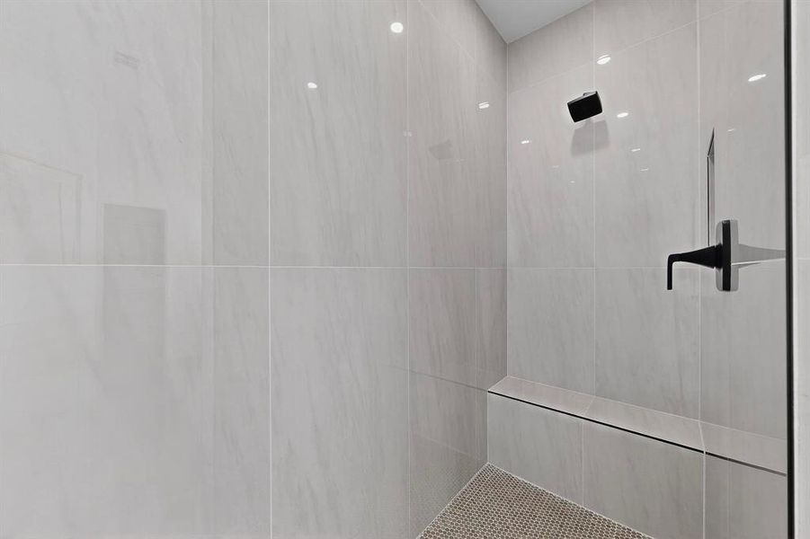 Full bathroom with tiled shower