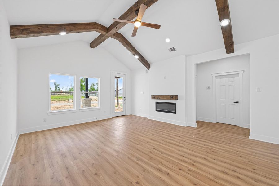 Bright and open entry leading into the main living space with soaring ceilings and natural light.