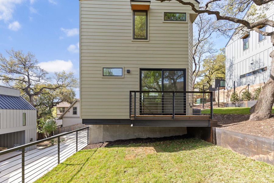 Back of property featuring a deck