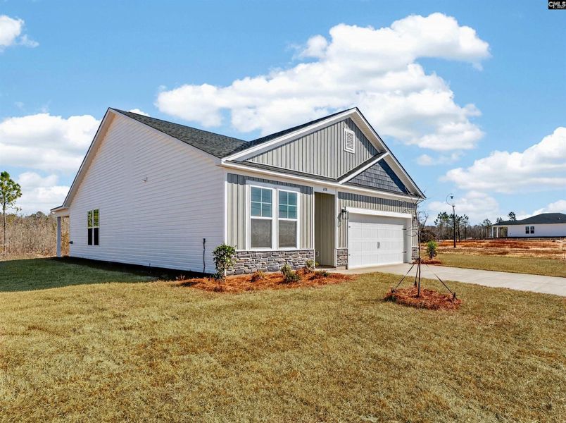 Front exterior of a new home in Old Charleston Acres, Pelion, SC, highlighting curb appeal (Image 21).