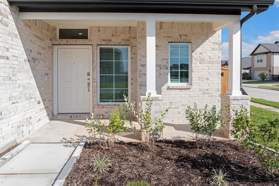 Inviting entryway and modern architectural touches create a warm welcome for guests.
